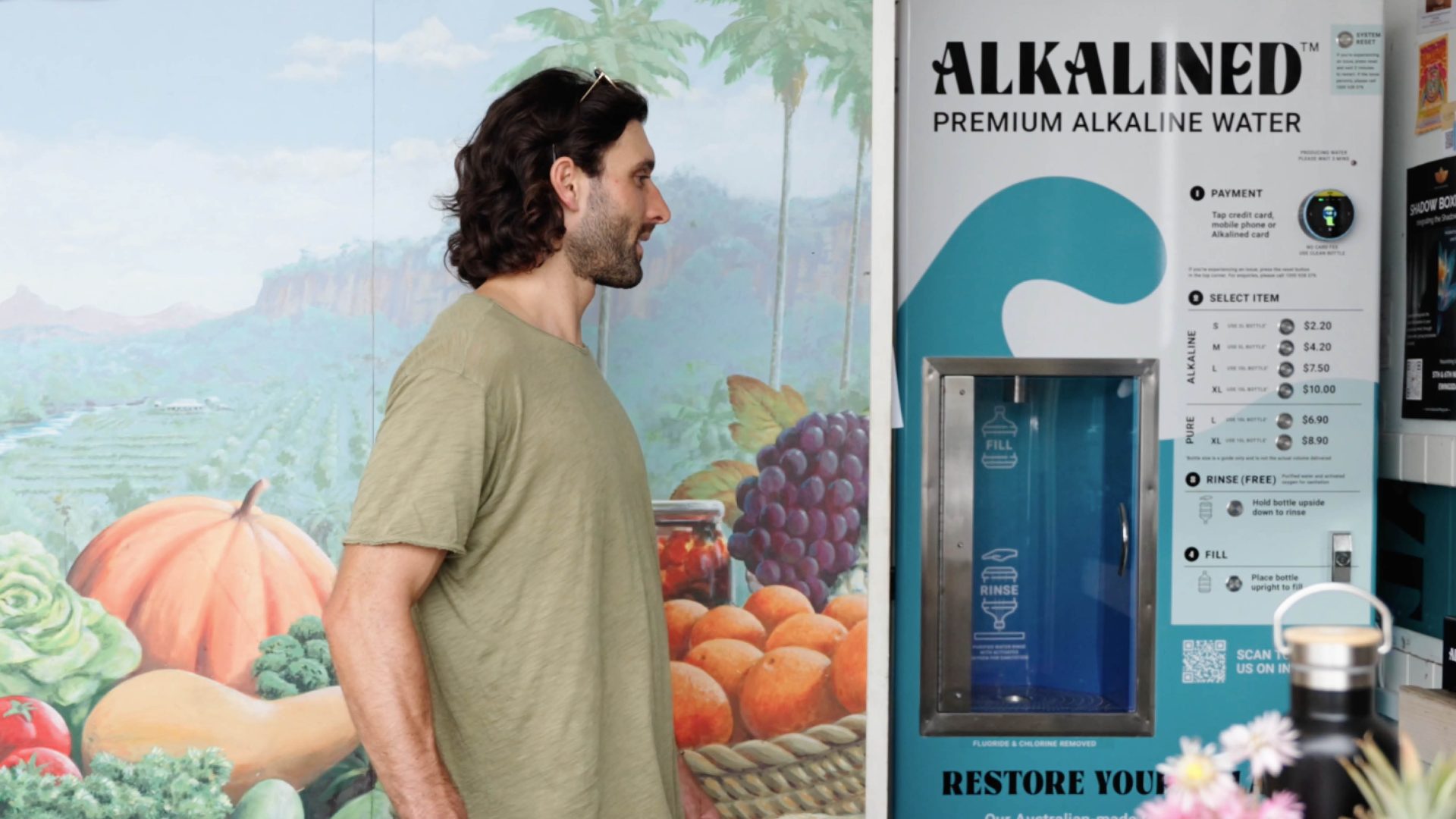 Ben Verdoliva from Benilato in Byron Bay is at Santos Organics filling up Alkalined alkaline water.