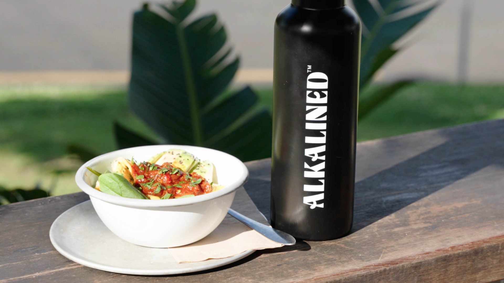 Brand photography of Alkalined water bottle and healthy bowl at TopShop Byron Bay.