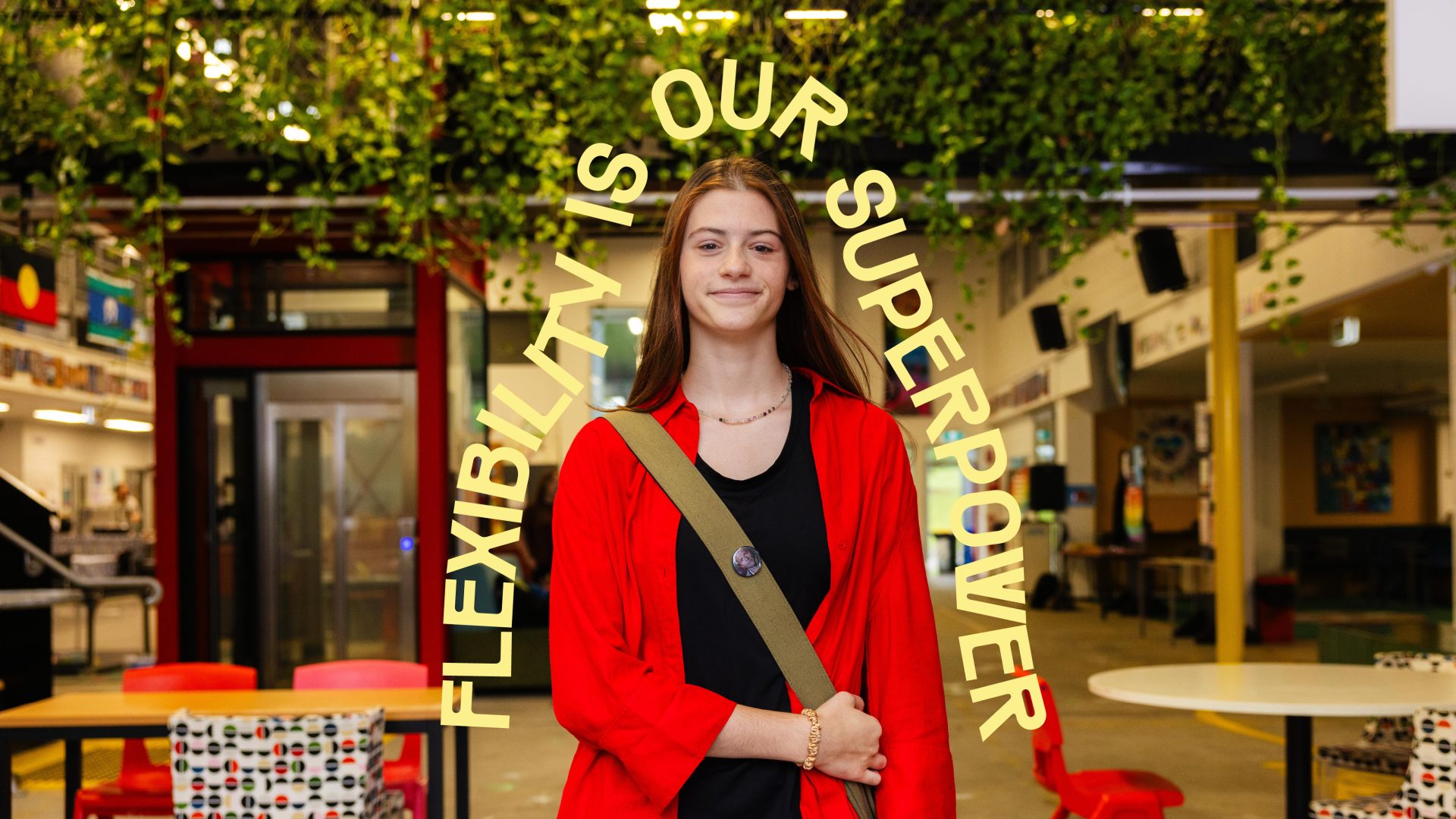 Brand photography of a high school girl holding a bag, showing a custom typography design for Jabiru Community College, featuring a bright, bold, clean aesthetic.